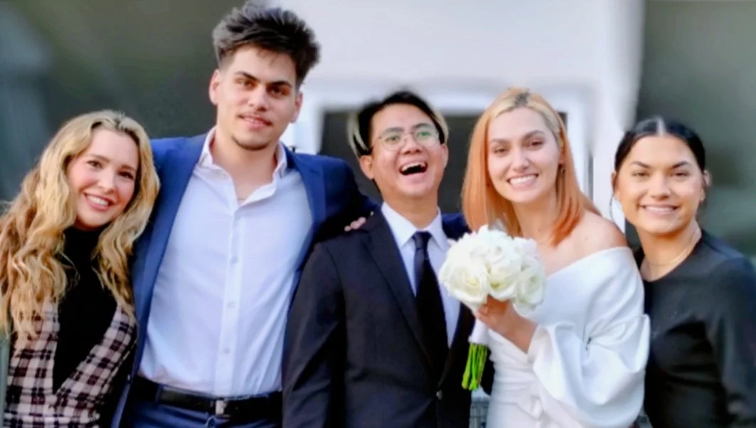 Children and spouses of Greg Nicholson, DDS, together at a family wedding